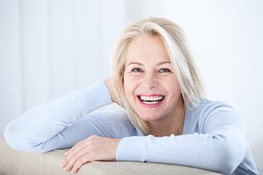 smiling woman with gray hair