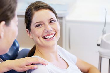 Smiling woman in dental chair