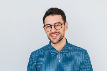 smiling man with glasses