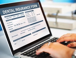 Dental insurance form on laptop monitor