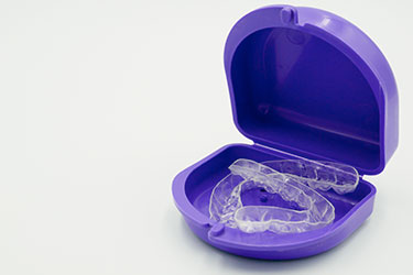 Invisalign clear braces in cleaning tray