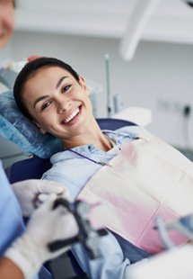 Woman smiling while at the dentist
