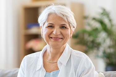 Woman smiling on the sofa at home