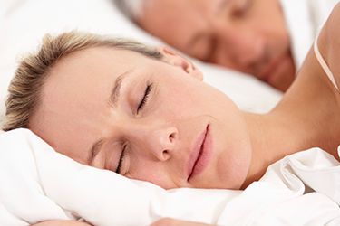 Woman sound asleep in bed