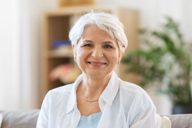 Older woman sitting on the sofa