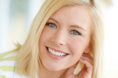 Young woman with flawless healthy smile