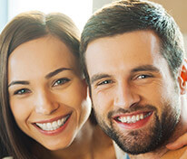 Smiling couple with healthy teeth