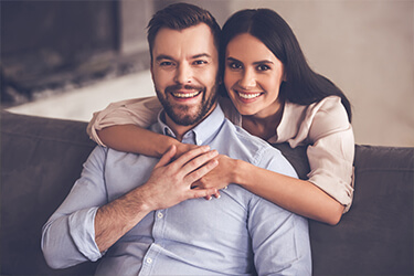 Happy couple with healthy attractive smiles