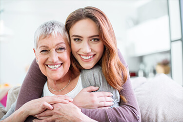 Smiling mother and daughter