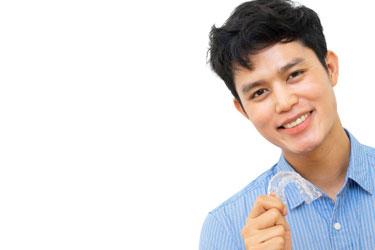 Smiling young man enjoying daily life with Invisalign
