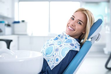 Woman smiling in the dental chair