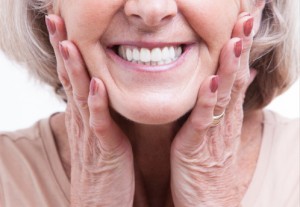 woman with dentures smiling