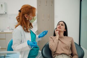 Concerned woman speaking to her dentist 
