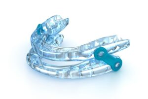 Oral appliance for sleep apnea against white background 