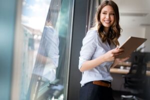 Confident, smiling woman in business 
