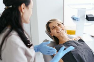 Dentist and patient having a friendly conversation 