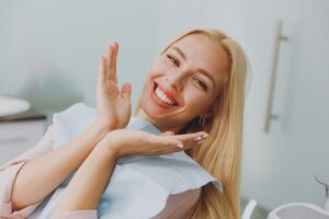 Dental patient showing her smile after teeth whitening