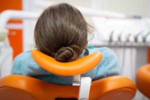 Behind view of relaxed dental patient enjoying benefits of sedation dentistry