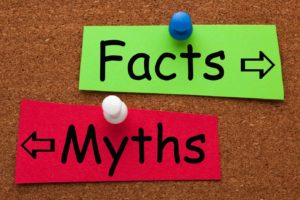 Close-up of myth vs. facts signs on bulletin board