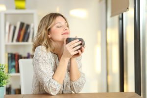  Invisalign patient enjoying a delicious cup of coffee