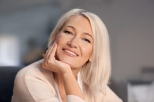 Portrait of attractive middle-aged woman with dental implants