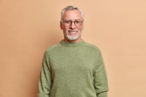 Senior man happy with his decision to transition from dentures