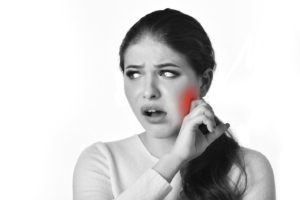 black and white photo of woman in need of jaw pain relief