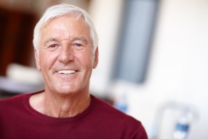 Man with a beautiful smile thanks to his all-on-4 dental implants